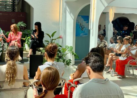 Fashion industry speakers addressing an audience during a Miami Swim Week Next Impact panel